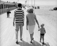 stripe-shirts-mother-father-child-at-the-beach-boardwalk.jpg